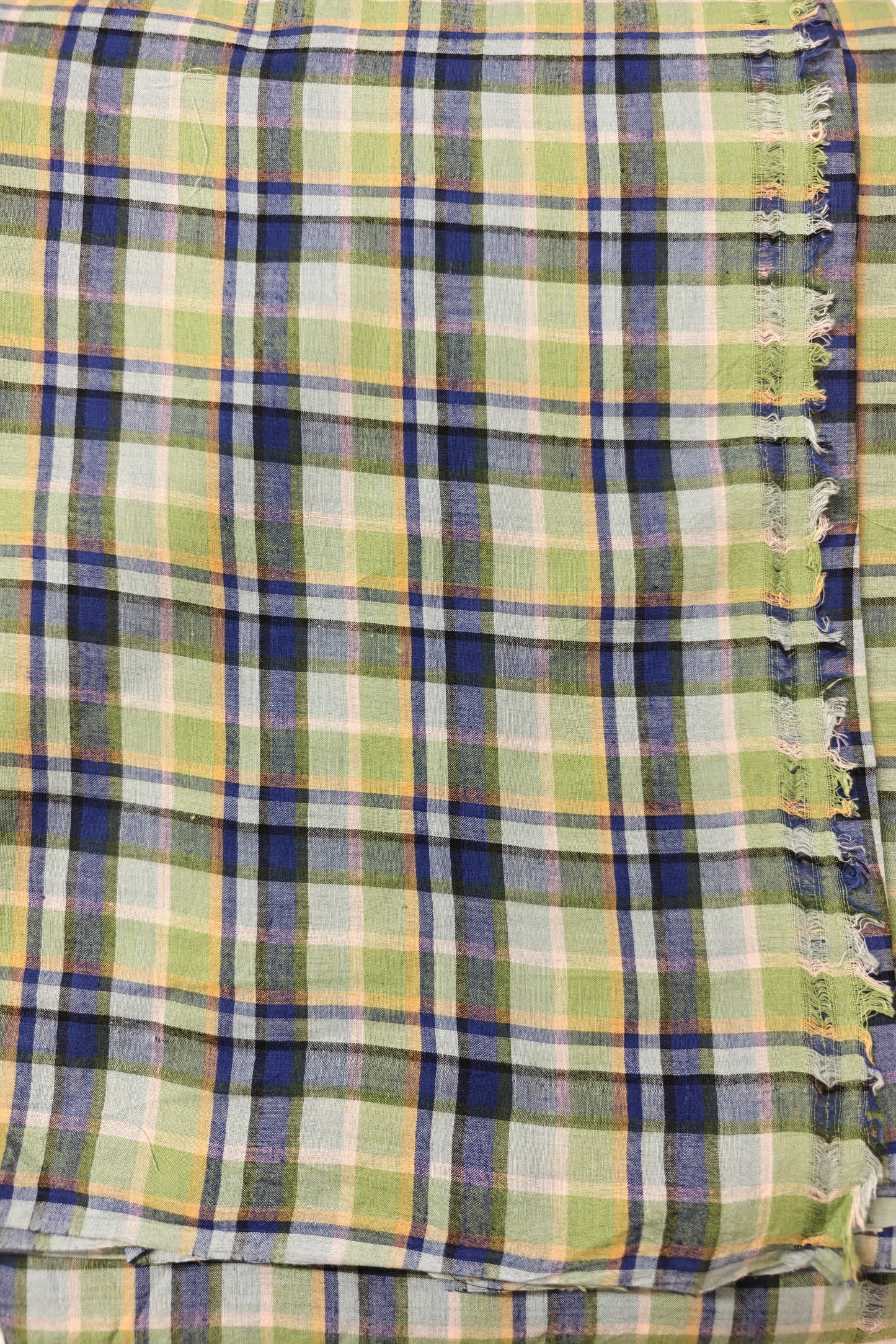 Eco-friendly handwoven cotton plaid in green and blue – perfect for sustainable fashion designers.
