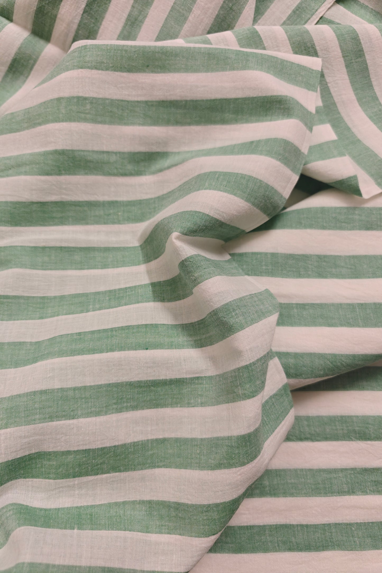 Indian handloom cotton fabric with green yarn-dyed stripes – airy and artisan-made.