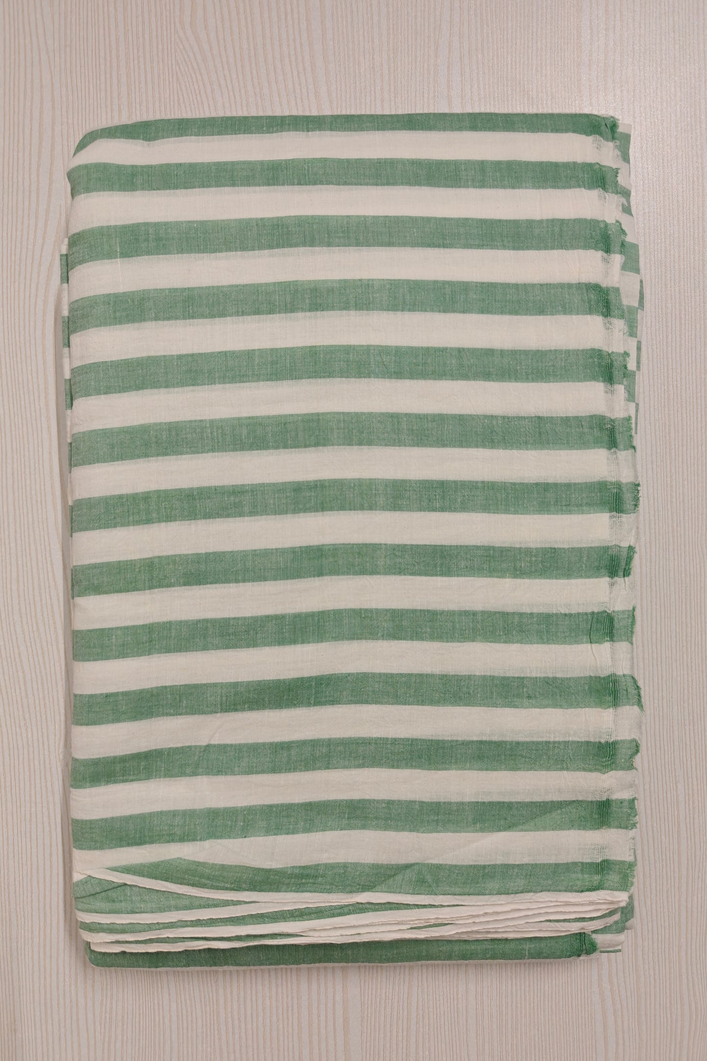 Handwoven green cotton fabric with stripes – ideal for slow fashion collections.
