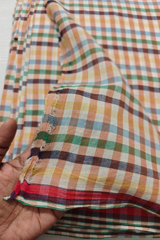 Colorful handwoven cotton fabric with multicolor checks, soft texture, yarn-dyed with azo-free dyes, ideal for kidswear and summer dresses.