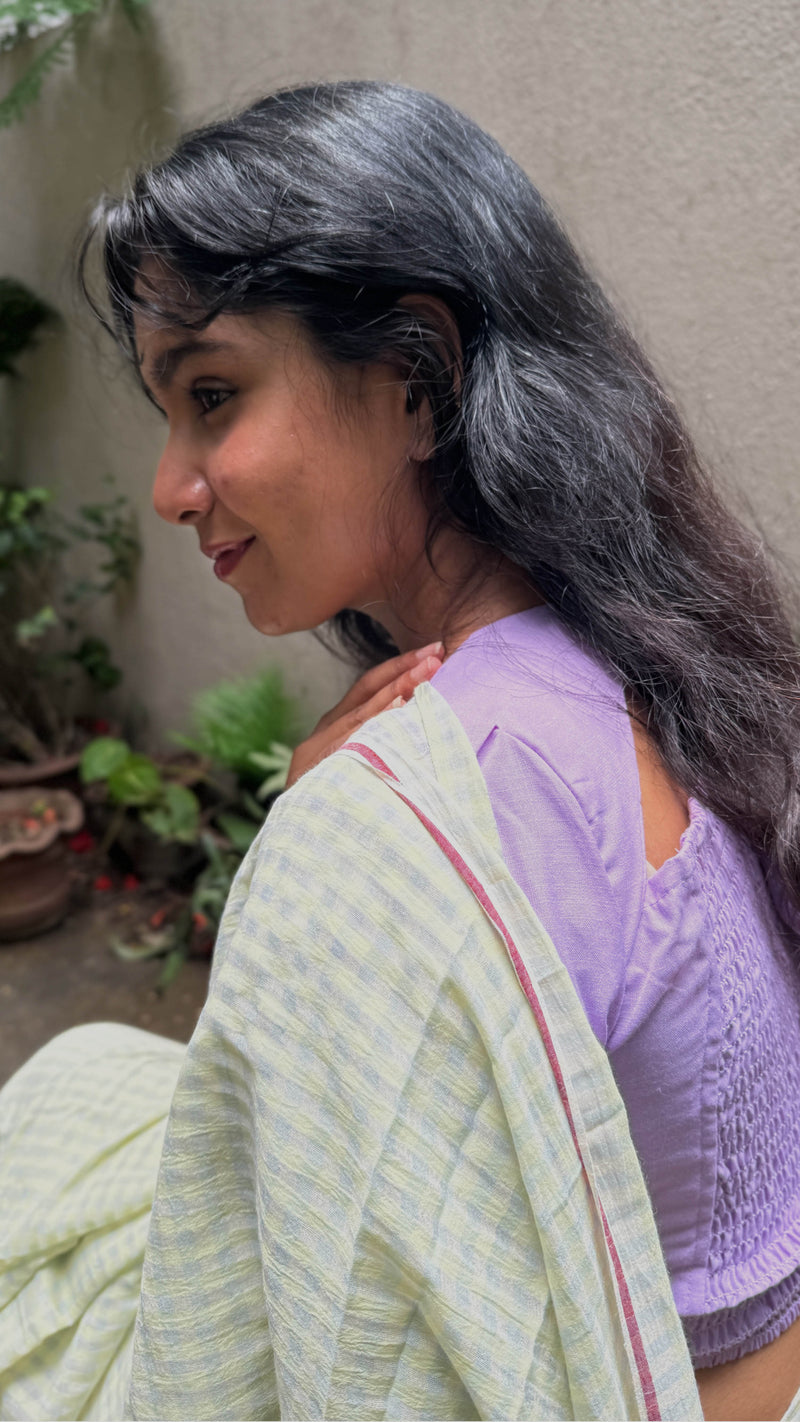 Traditional Bengal cotton saree with pale green checks and woven border