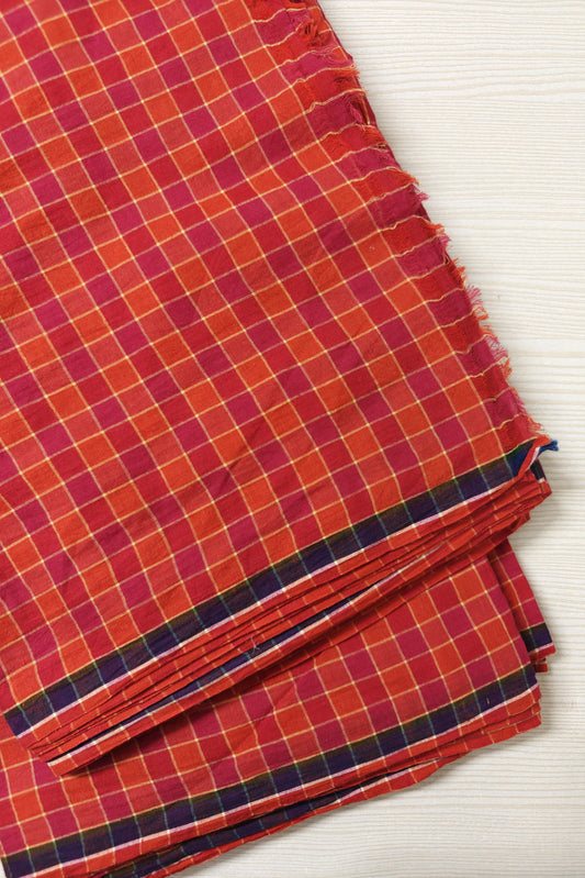 Vibrant checks in pink and orange with contrast blue selvedge – lightweight handwoven fabric.
