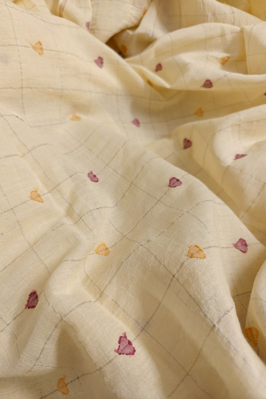 Sustainable Indian cotton textile – handwoven jamdani fabric in pale yellow with pretty heart details.

