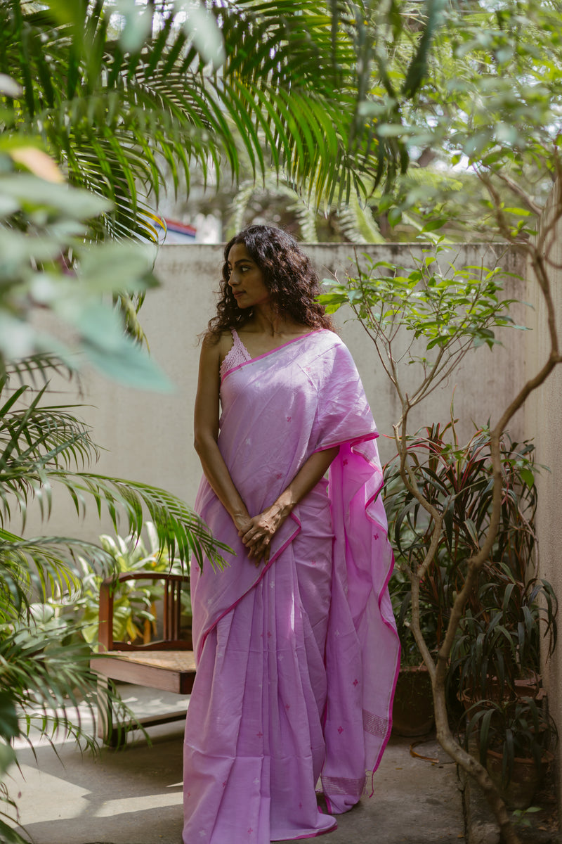 Handwoven purple cotton Jamdani saree with artisanal craftsmanship