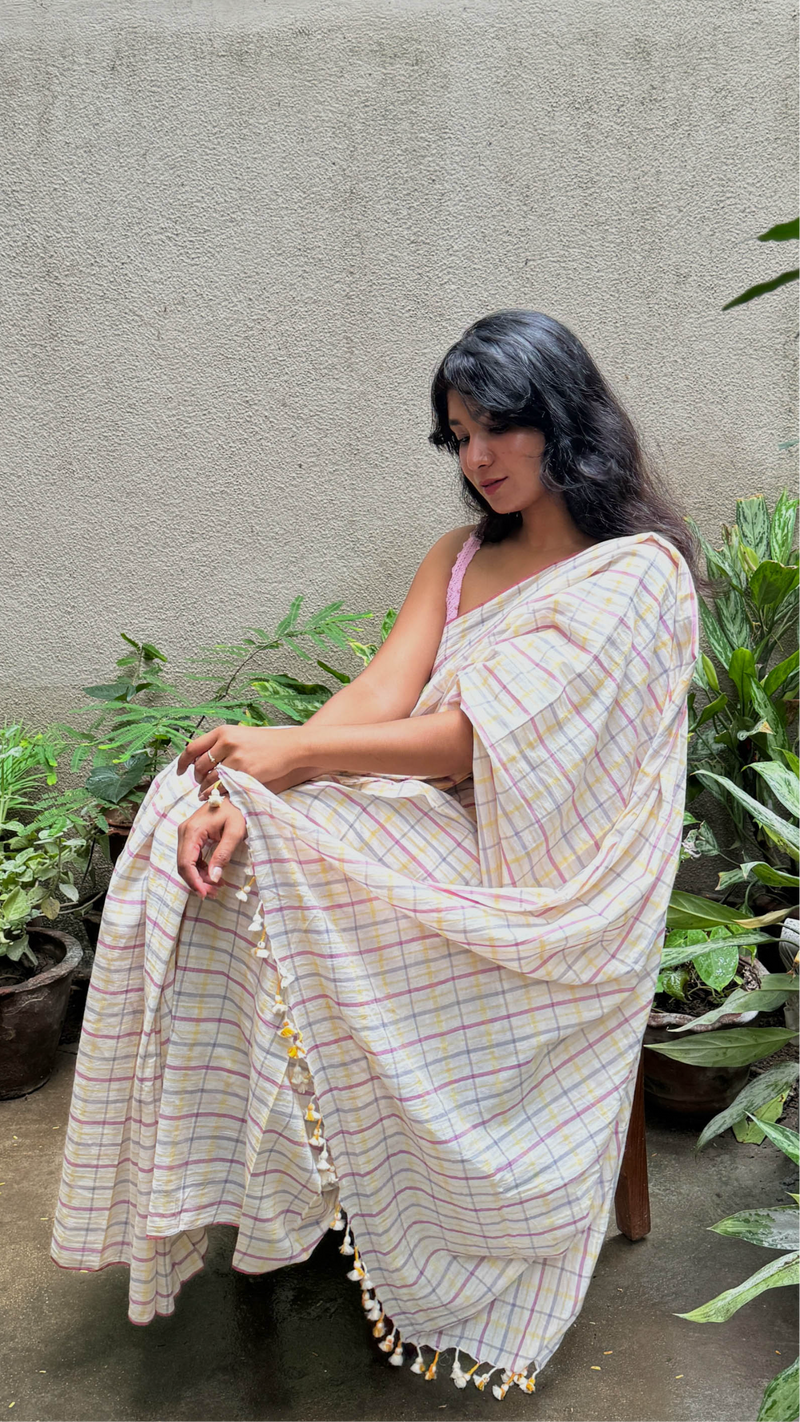 Woman wearing VarsaaEdit multi-coloured Checks Khadi Cotton Saree – handwoven Bengal handloom drape with elegant traditional design