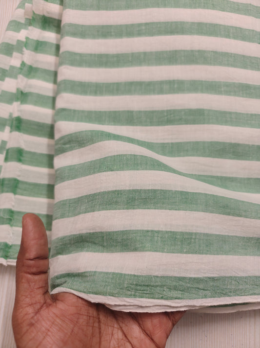 Sustainable striped green cotton fabric – sold by the meter for conscious clothing.
