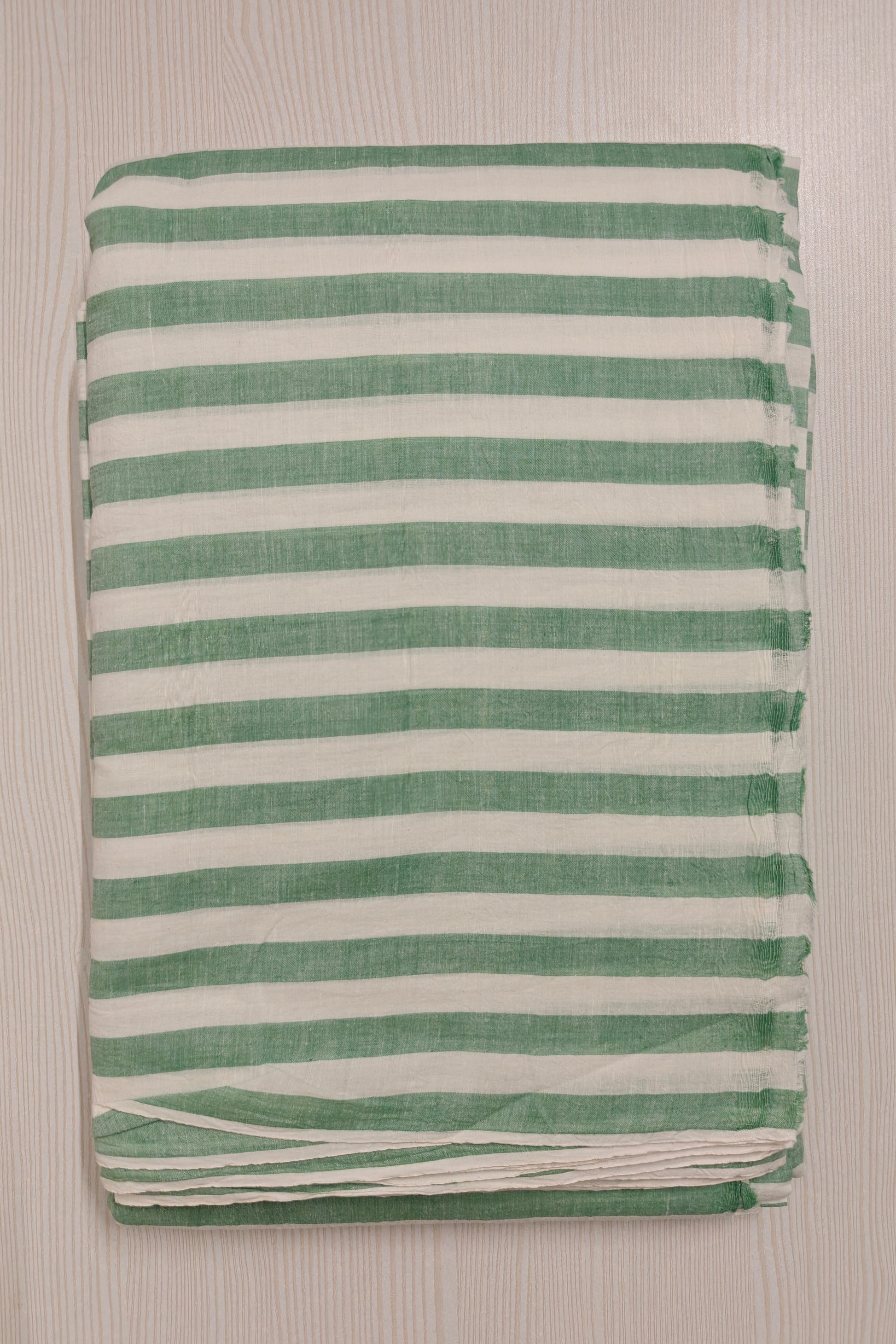 Handwoven green cotton fabric with stripes – ideal for slow fashion collections.