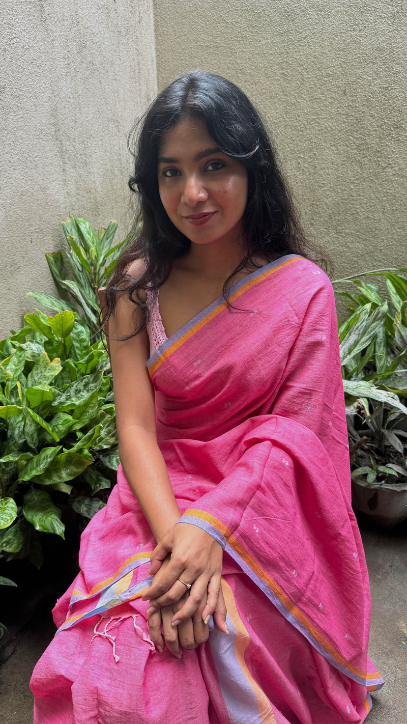 Sustainable fashion bright pink Jamdani saree with intricate handloom work