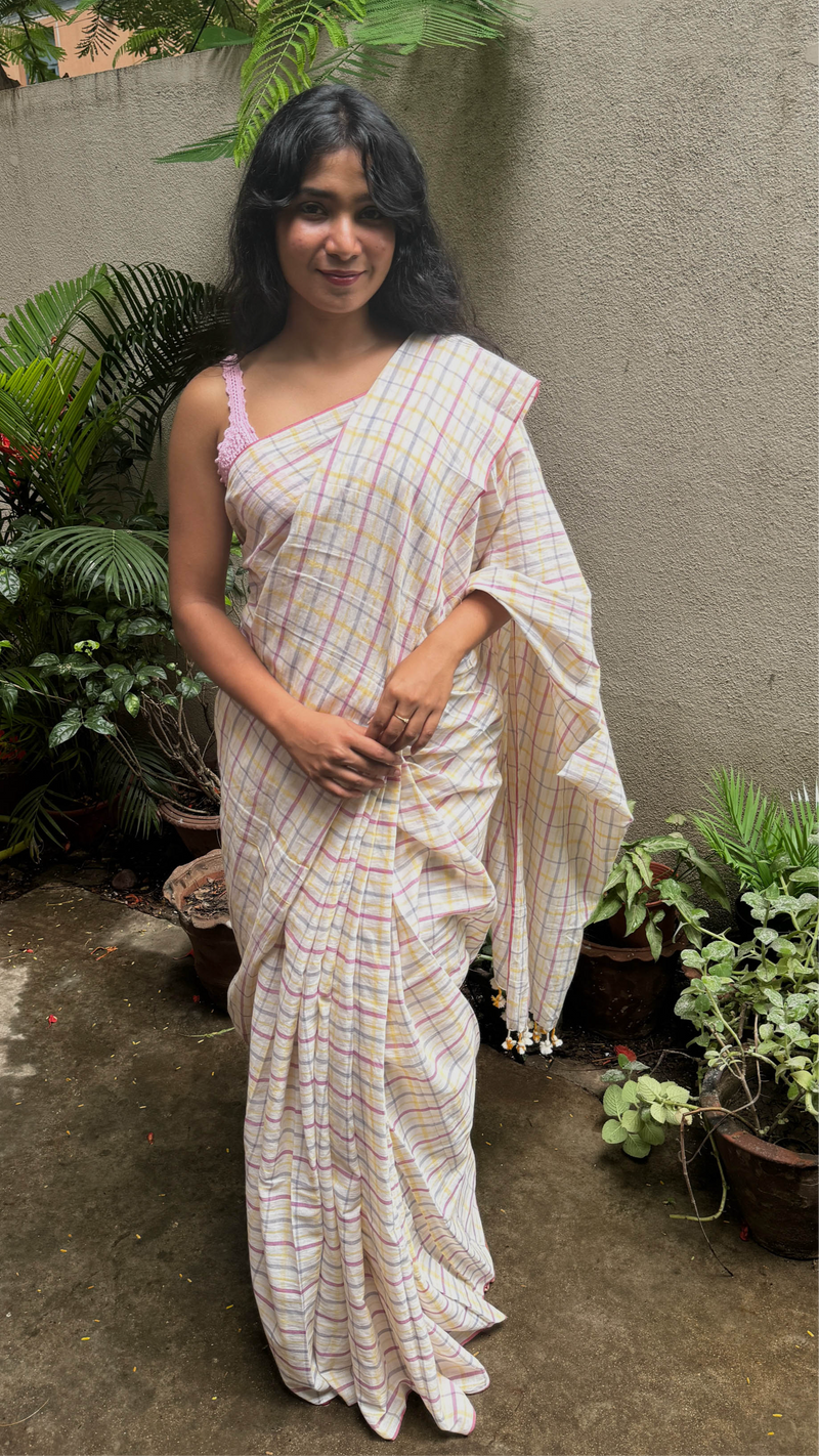 Model draped in VarsaaEdit’s Peach & Yellow Checked Khadi Cotton Saree – artisanal Bengal weave in sustainable handloom cotton