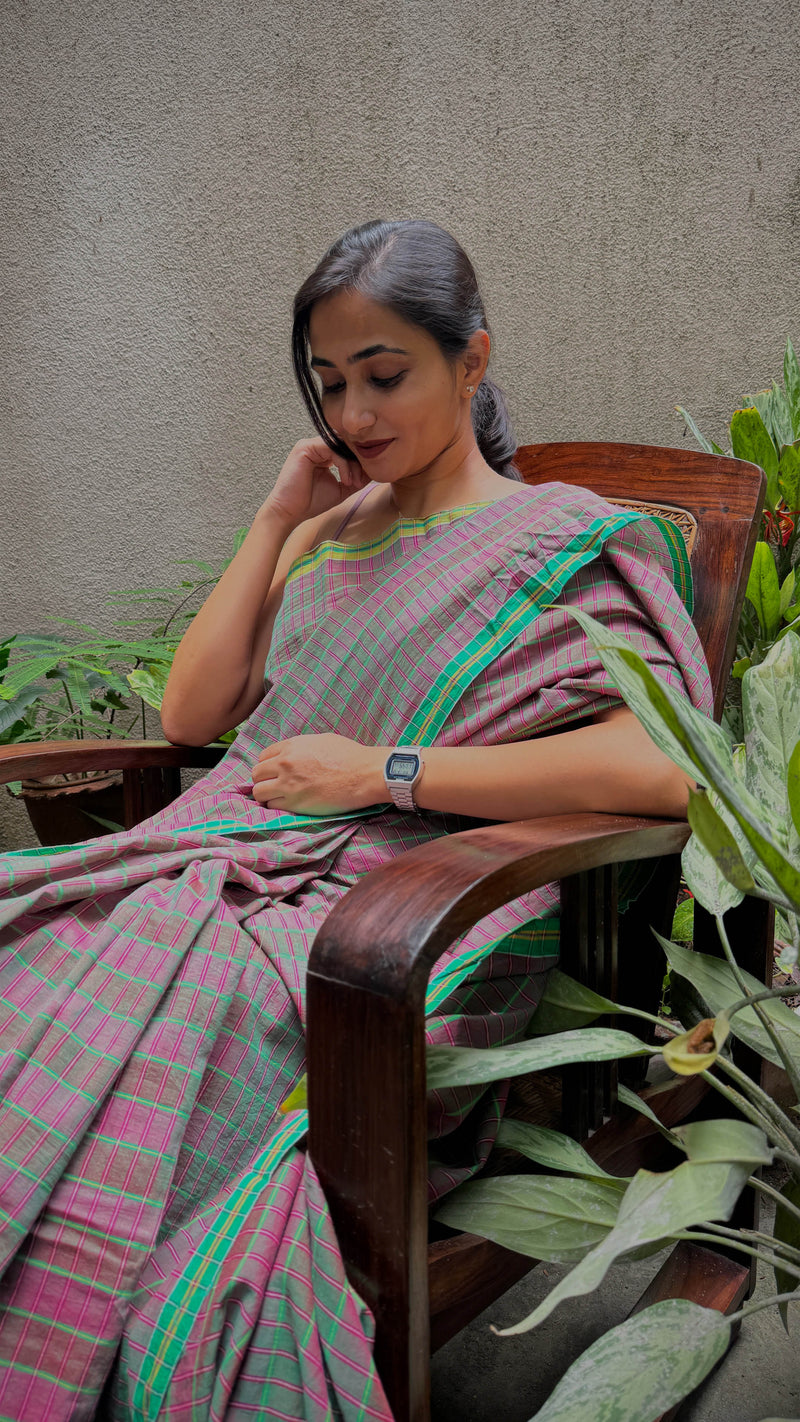 Eco-friendly handloom cotton saree in vibrant pink, green, and yellow tones
